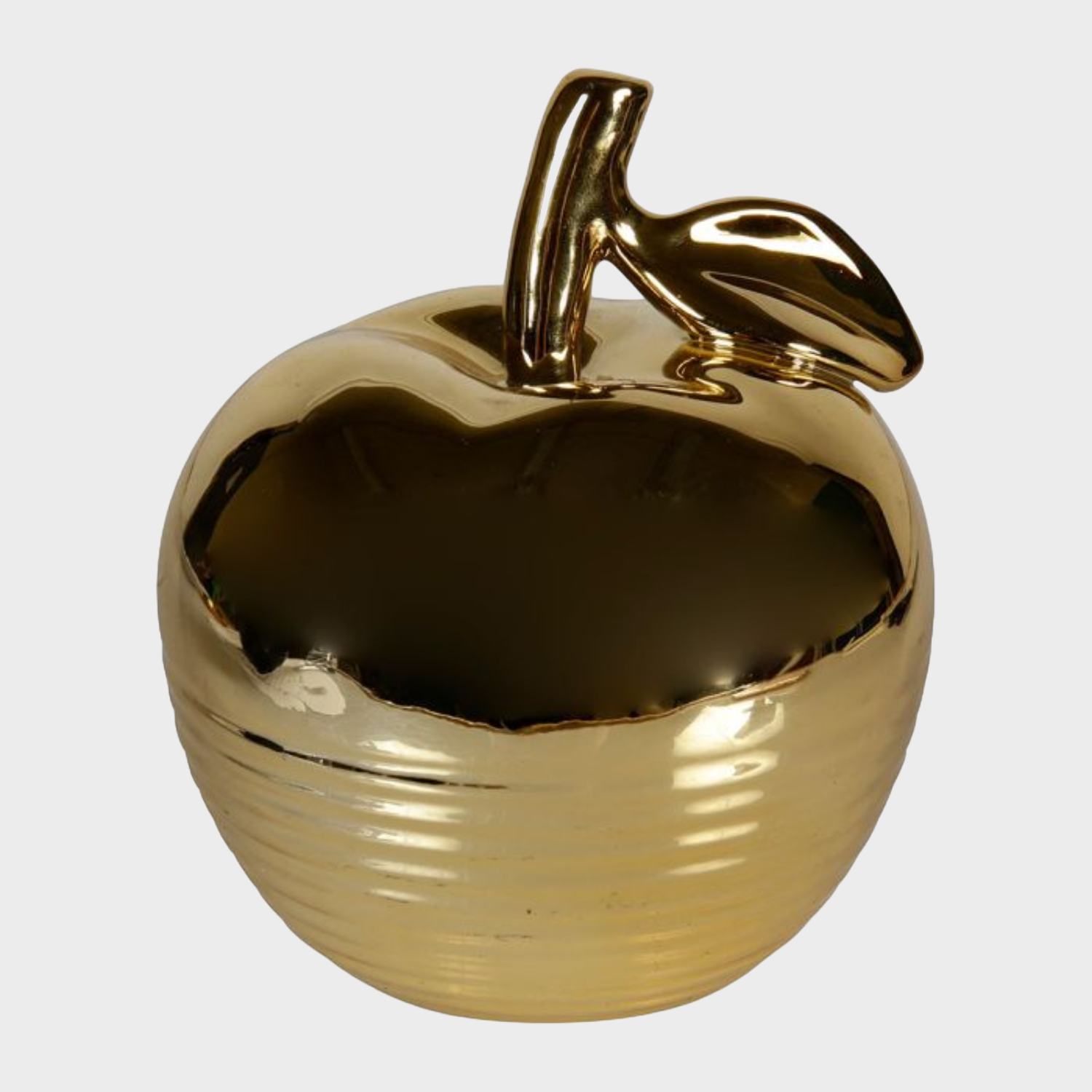 Pomme en céramique dorée, ajoutant élégance et sophistication à la décoration intérieure.