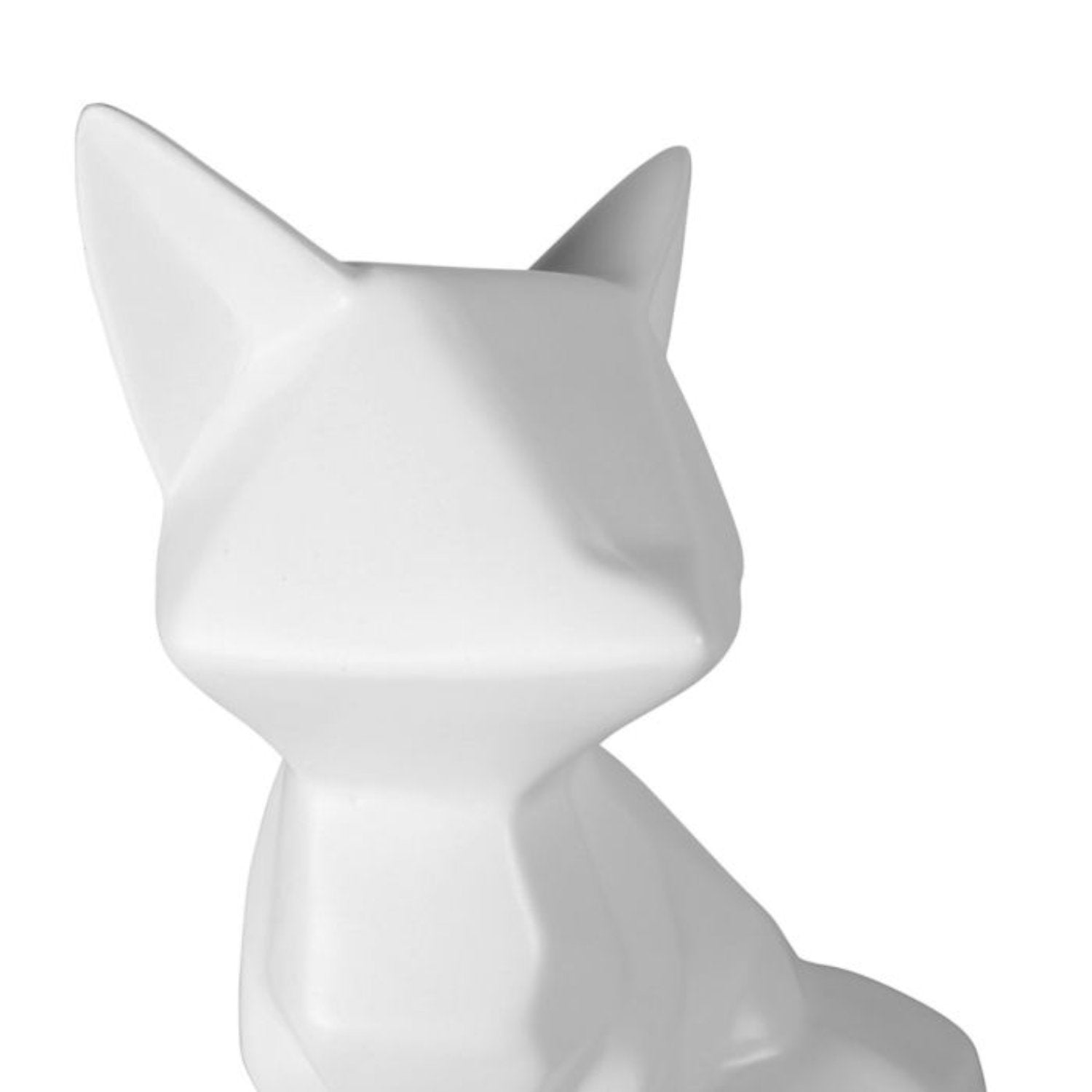 Statuette en céramique représentant un renard blanc, ajoutant originalité et charme à la décoration intérieure.