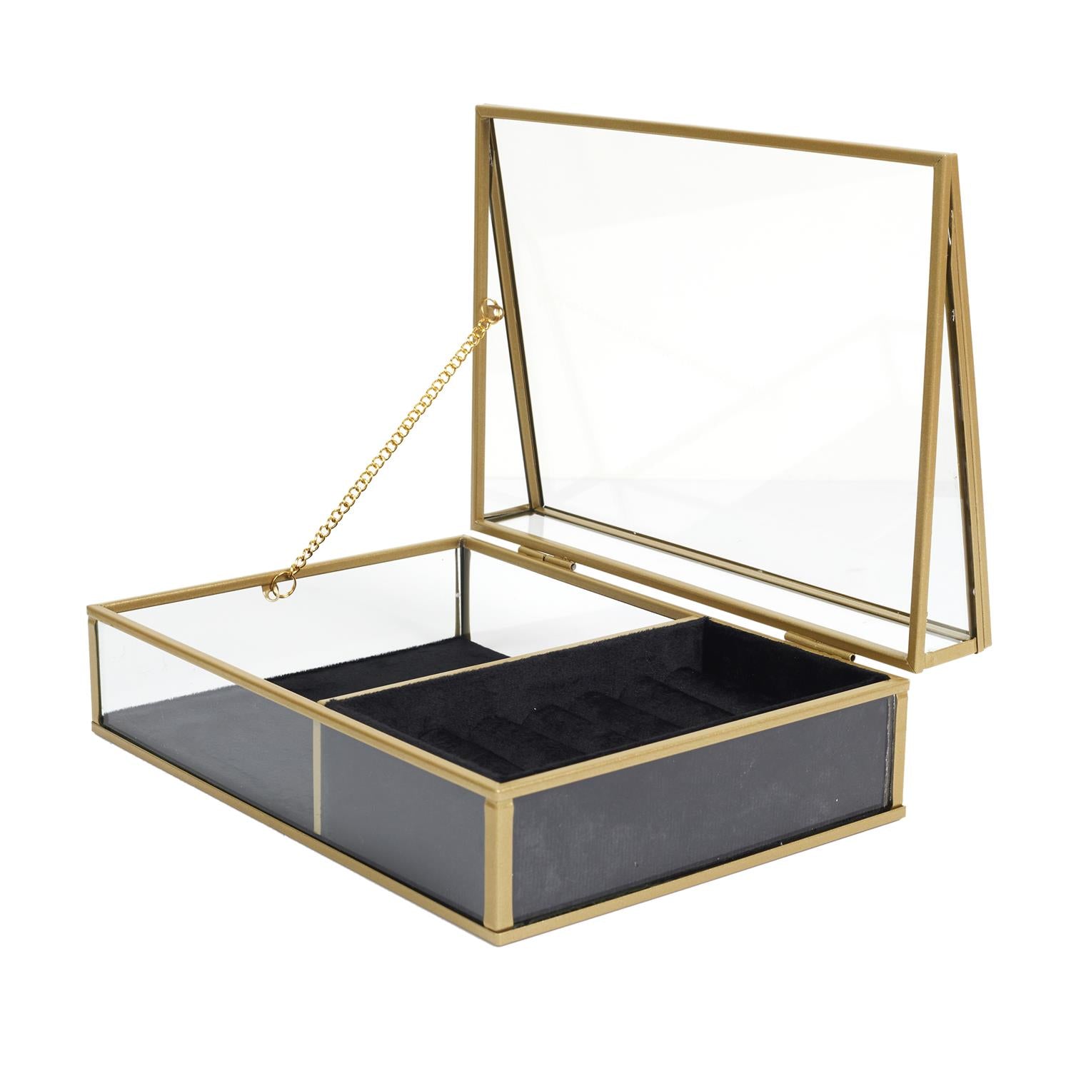 Boîte de rangement en verre avec intérieur en velours noir, idéale pour ranger et trier les bijoux sur la coiffeuse.